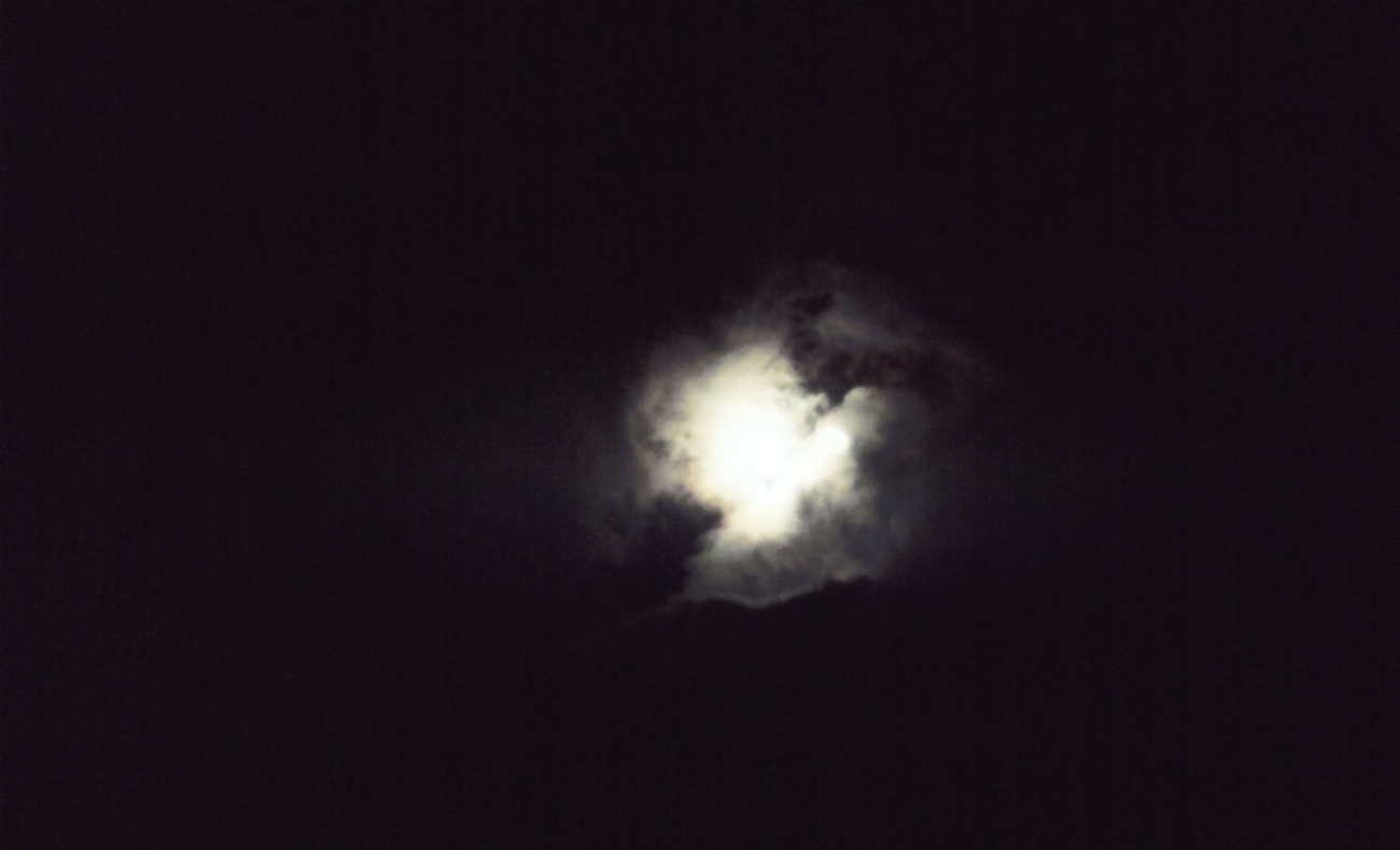 Moon through the clouds (Image credit: Commander John Bortniak) Moon through the clouds