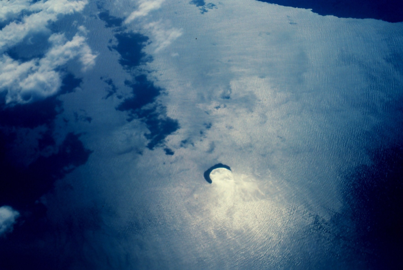 Molokini Island, a crescent island, is rim of volcanic crater opening to northShore of Kahoolawe is visible in upper right (Image credit: Commander John Bortniak) Molokini Island, a crescent island, is rim of volcanic crater opening to northShore of Kahoolawe is visible in upper right