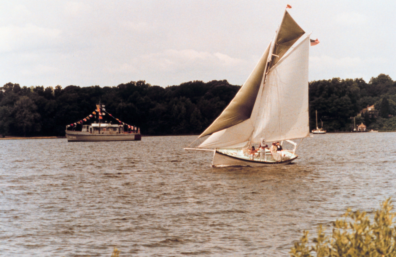 A Navy YP dressed for a holiday while the GALATEA, an old gaff-rigged cutter,travels the waters of the St (Image credit: Mary Hollinger) A Navy YP dressed for a holiday while the GALATEA, an old gaff-rigged cutter,travels the waters of the St