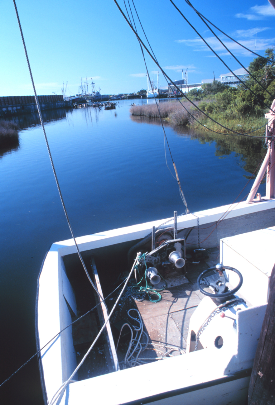 A view of the port at Wanchese over the stern of a small shrimp boat