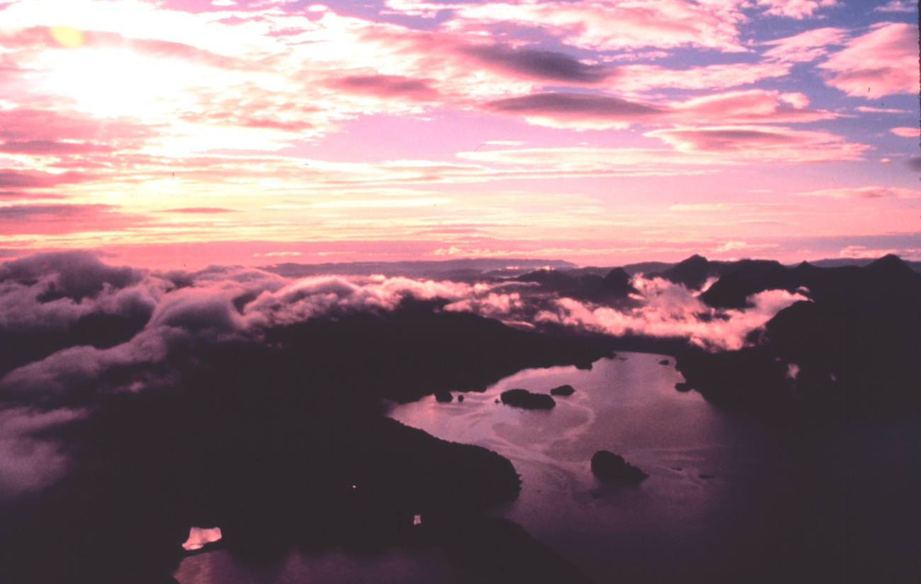 Sunset over Prince William Sound while sheen of oil is seen on surface ofwater (Image credit: EXXON VALDEZ Oil Spill Trustee Council) Sunset over Prince William Sound while sheen of oil is seen on surface ofwater