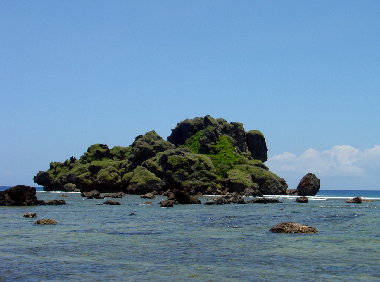 Outline of an offshore Guam islet softened and subdued by erosion andvegetation