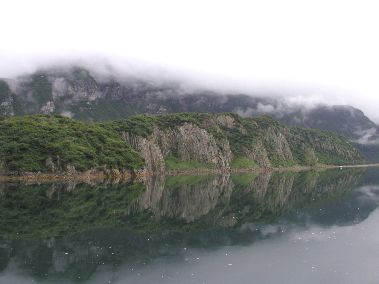 Magnificent scenery of Geographic Harbor reflected off still waters