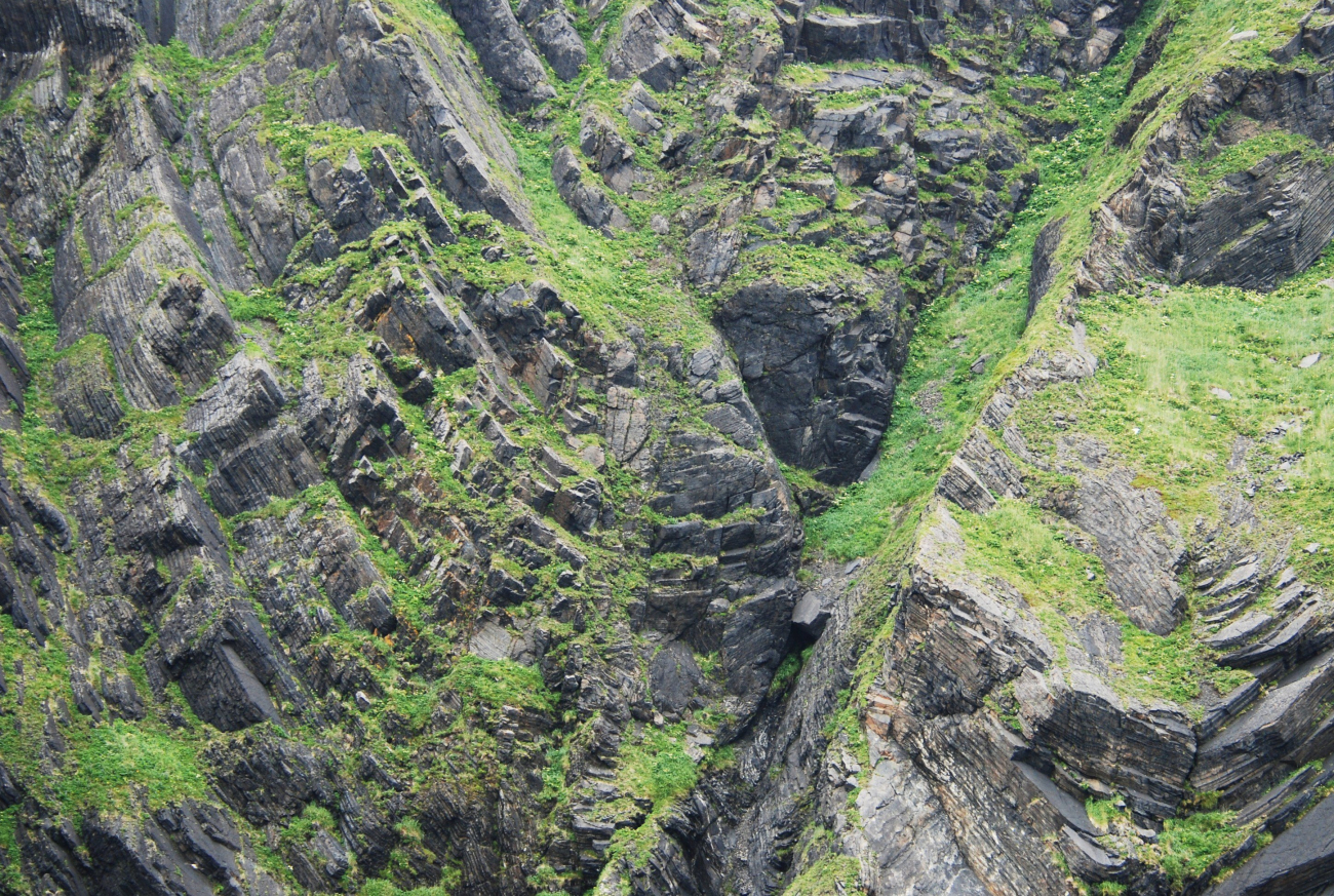 Radically folded sedimentary beds (Image credit: Ensign Patricia Raymond) Radically folded sedimentary beds