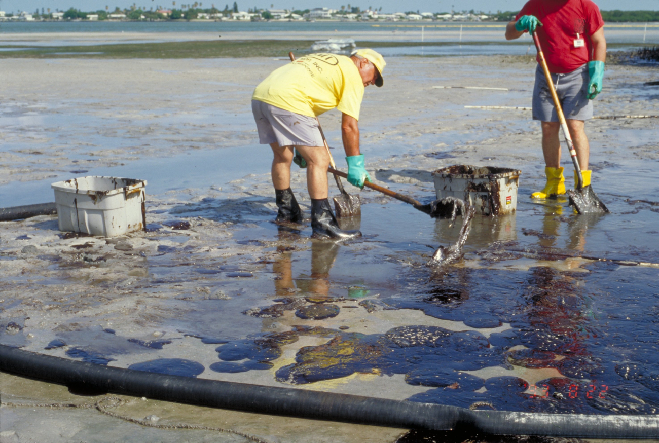 Cleaning oil off a beach at low tide (Image credit: Collection of Doug Helton, NOAA/NOS/ORR) Cleaning oil off a beach at low tide