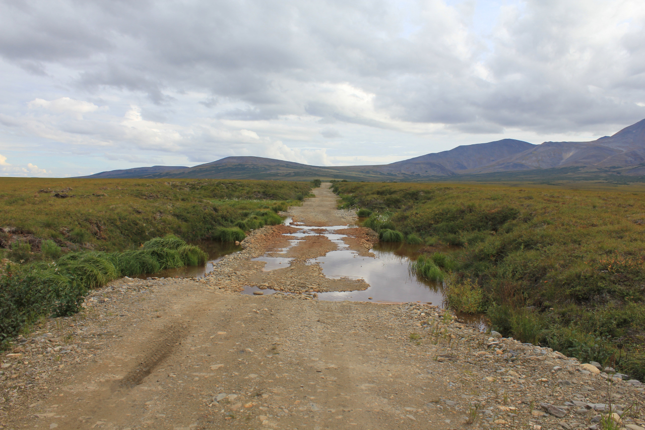 An example of thermo-karst topography caused by the melting of permafrostcausing the road to drop (Image credit: Dr. John Cloud) An example of thermo-karst topography caused by the melting of permafrostcausing the road to drop
