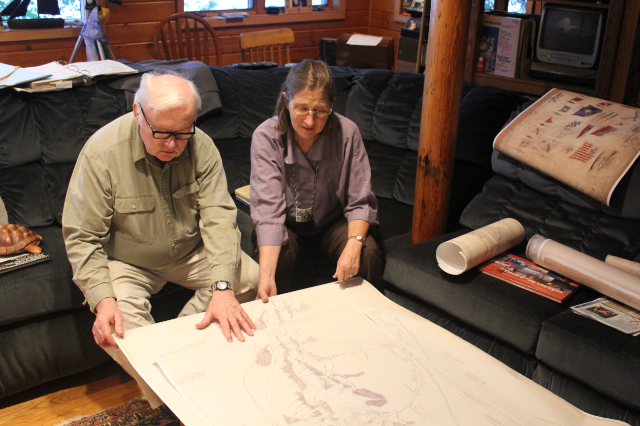 Kathy and William Ruddy, noted Alaskan historians, ethnographers, and legalauthorities, examining the Kohklux map brought by Dr (Image credit: Dr. John Cloud) Kathy and William Ruddy, noted Alaskan historians, ethnographers, and legalauthorities, examining the Kohklux map brought by Dr