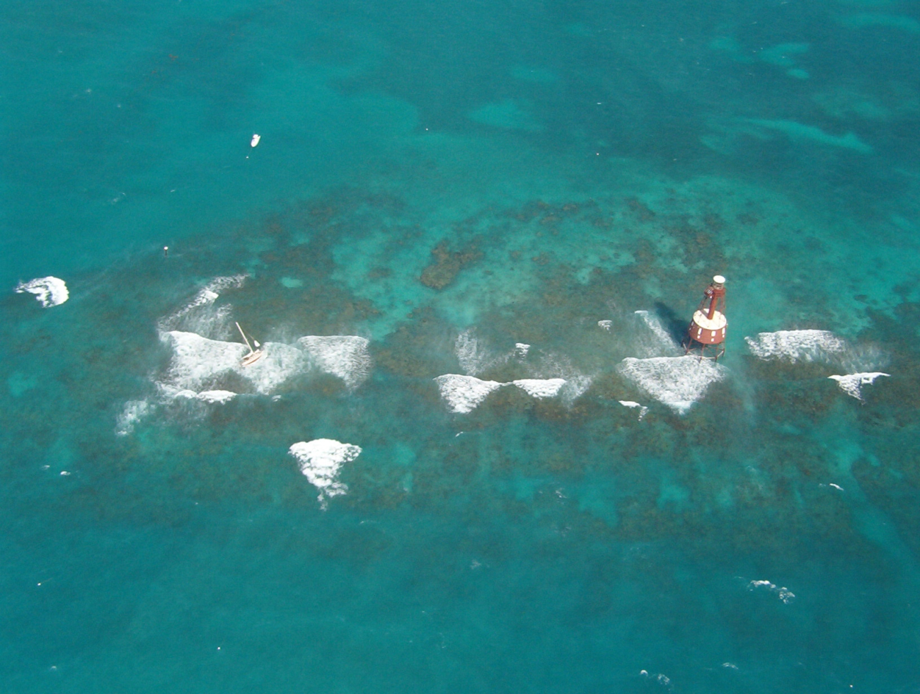 Carysfort Reef Lighthouse with derelict sailboat (Image credit: Florida Fish and Wildlife Conservation Commission | Officer Scott LaRosa Florida FWC) Carysfort Reef Lighthouse with derelict sailboat