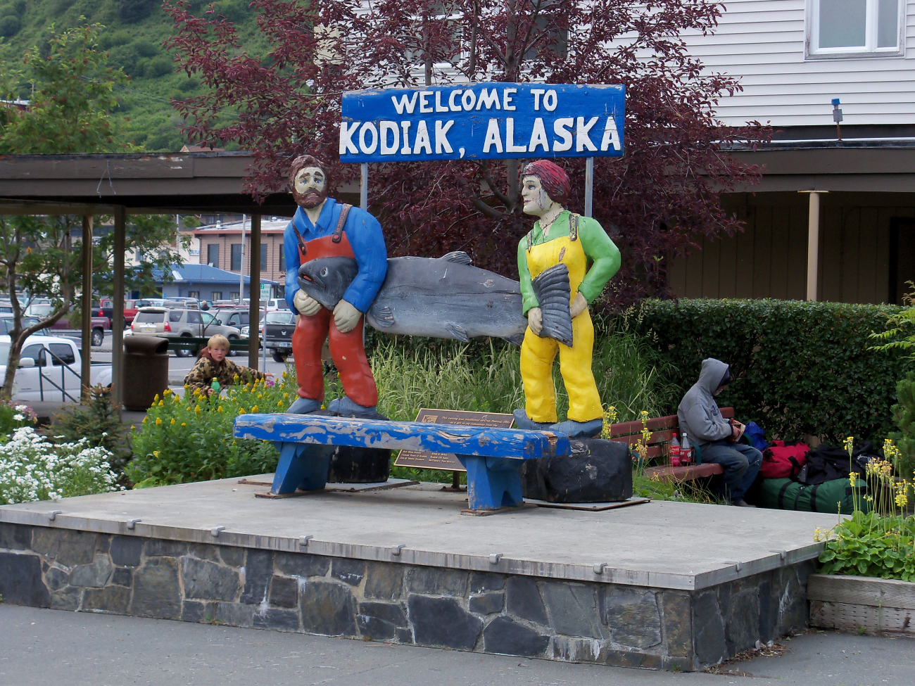 Fishermen with Paul Bunyanesque size salmon greet visitors to Kodiak (Image credit: Jenny Thacker304's Photostream, NOAA/NOS/OCS Flickr | Jenny Thacker) Fishermen with Paul Bunyanesque size salmon greet visitors to Kodiak