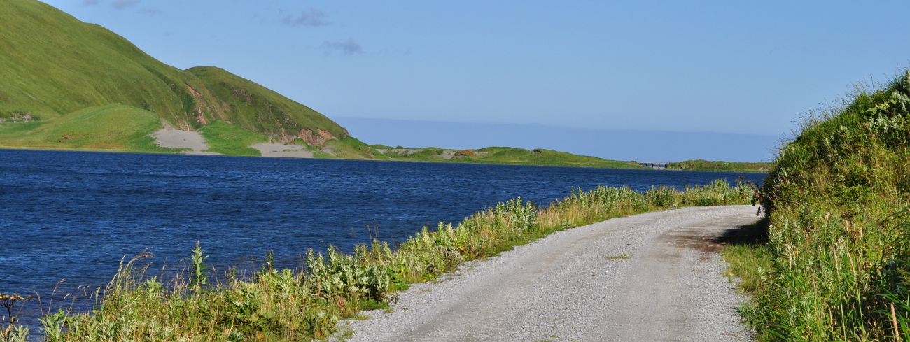 A gravel road running along the shoreline on a clear sunny day (Image credit: Mr. Tom Ward NOAA Teacher at Sea Program) A gravel road running along the shoreline on a clear sunny day