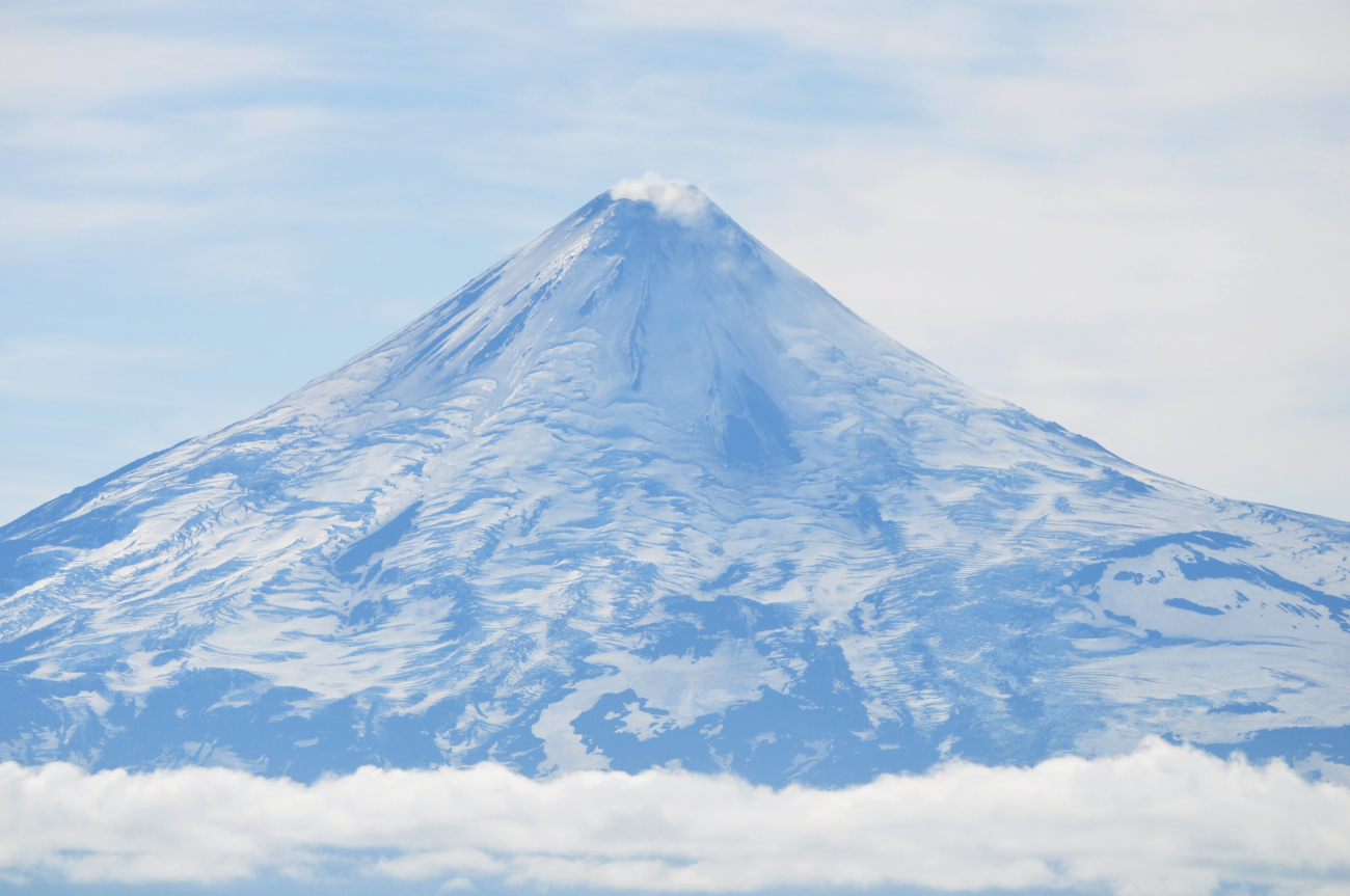 A telescopic view of Shishaldin Volcano showing that it is indeed an activevolcano with steam and gases discharging from the summit caldera (Image credit: Mr. Tom Ward NOAA Teacher at Sea Program) A telescopic view of Shishaldin Volcano showing that it is indeed an activevolcano with steam and gases discharging from the summit caldera