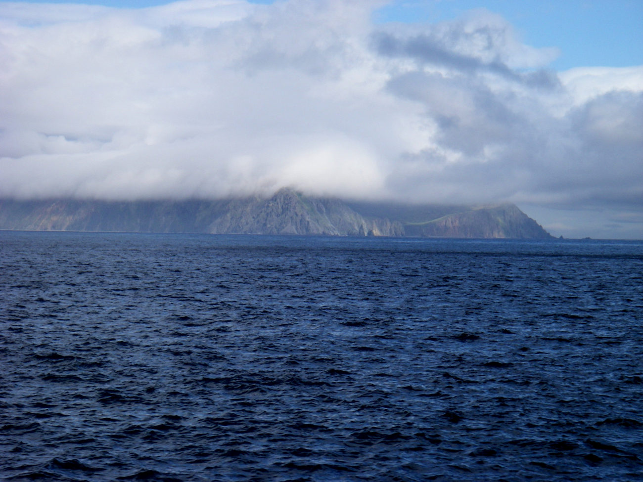 A cloud enshrouded Aleutian Island coastline (Image credit: NOAA Teacher at Sea Program | Jason Moeller Knoxville Zoological Gardens TN) A cloud enshrouded Aleutian Island coastline