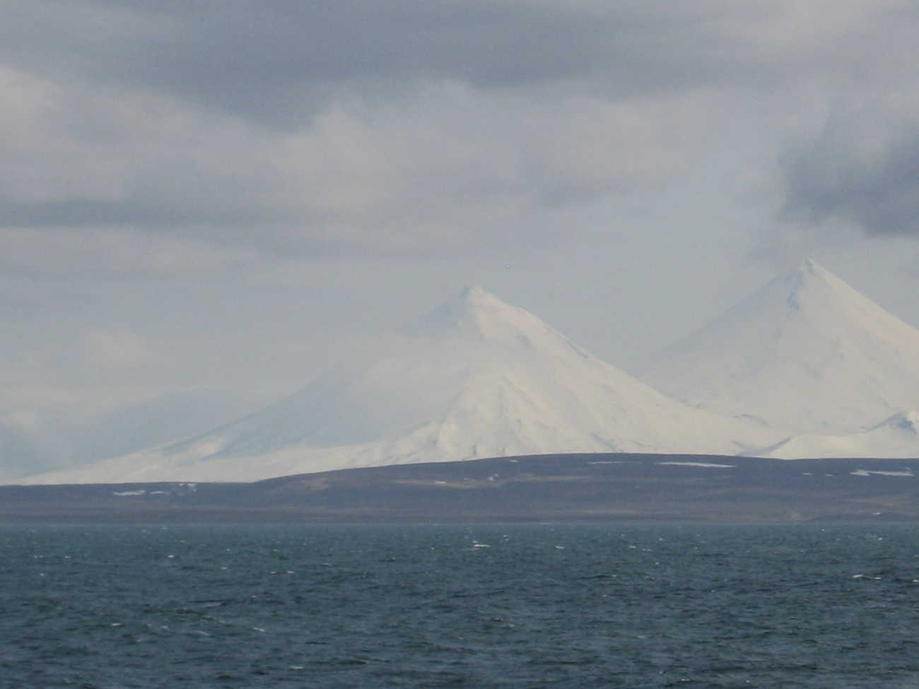 Pavlof Sister and Pavlof Volcano from the north side of the Alaska Peninsula (Image credit: Chief Mate Michael Theberge) Pavlof Sister and Pavlof Volcano from the north side of the Alaska Peninsula