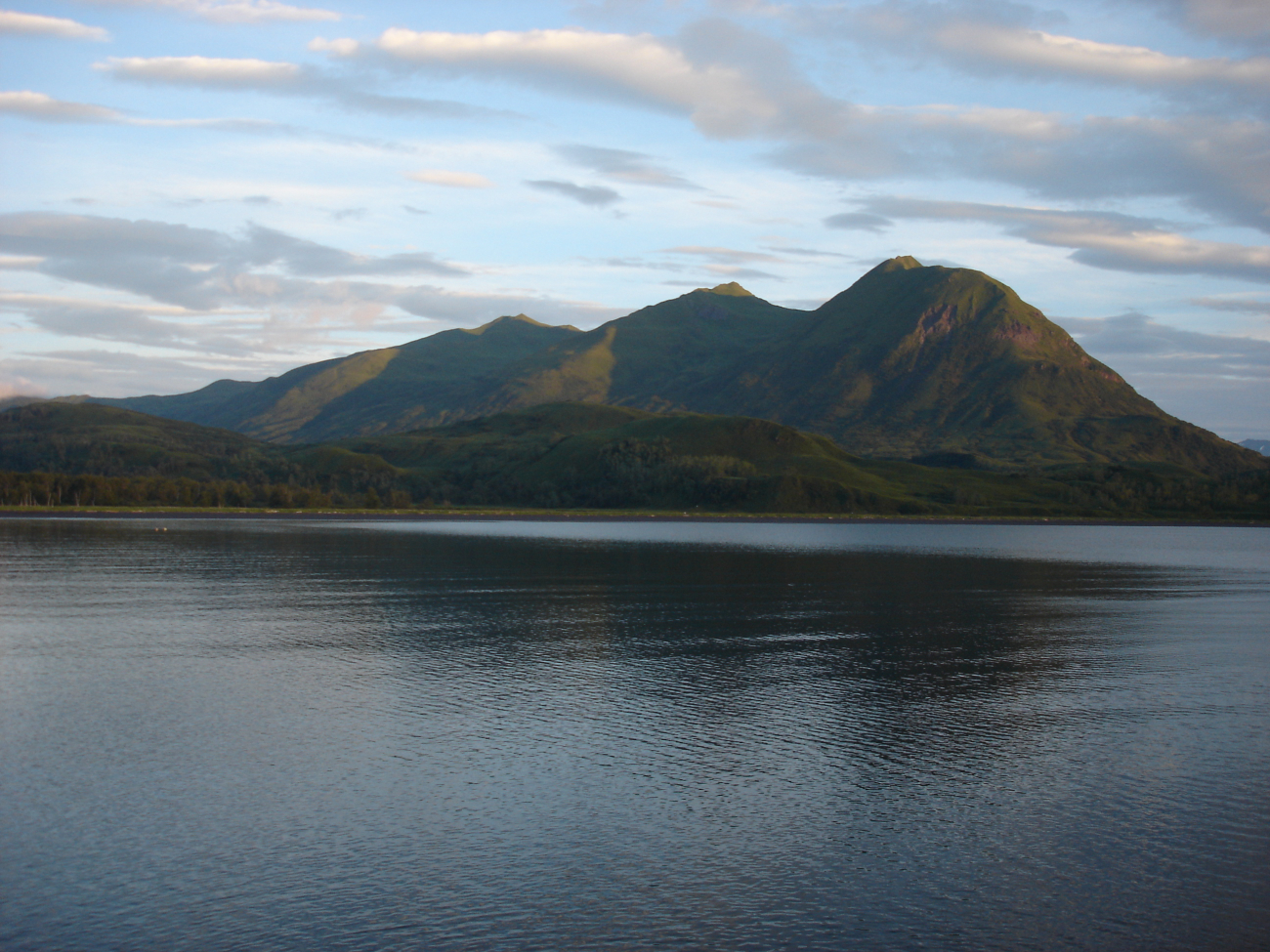 Mountains rise above a quiet Kodiak Island cove at the end of the day (Image credit: Crew and Officers of NOAA Ship MILLER FREEMAN) Mountains rise above a quiet Kodiak Island cove at the end of the day