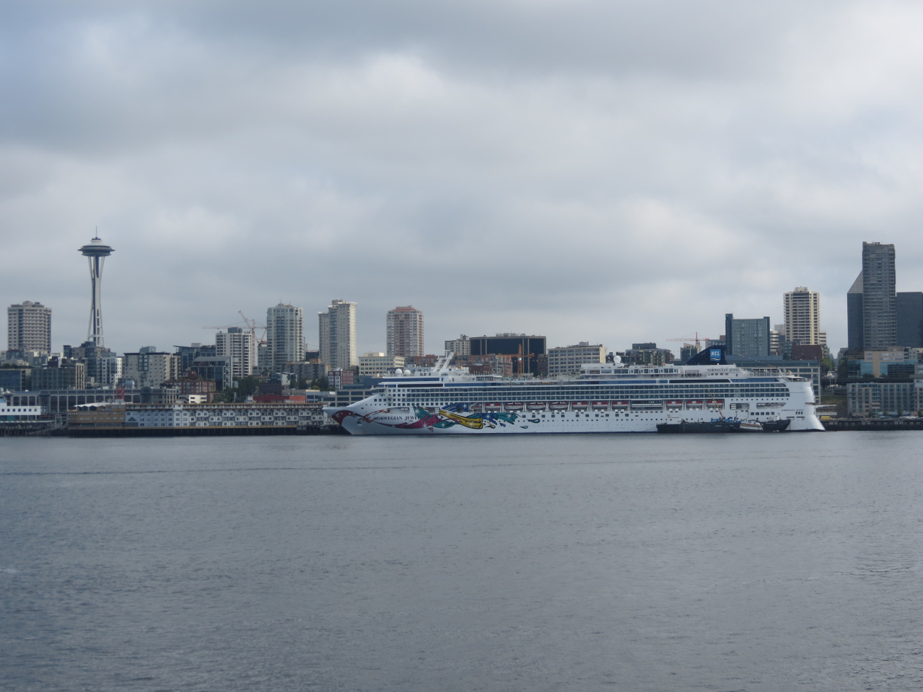 Seattle Space Needle and a large cruise ship, the NORWEGIANJEWEL, on the Seattle waterfront (Image credit: Crew and Officers of NOAA Ship FAIRWEATHER) Seattle Space Needle and a large cruise ship, the NORWEGIANJEWEL, on the Seattle waterfront