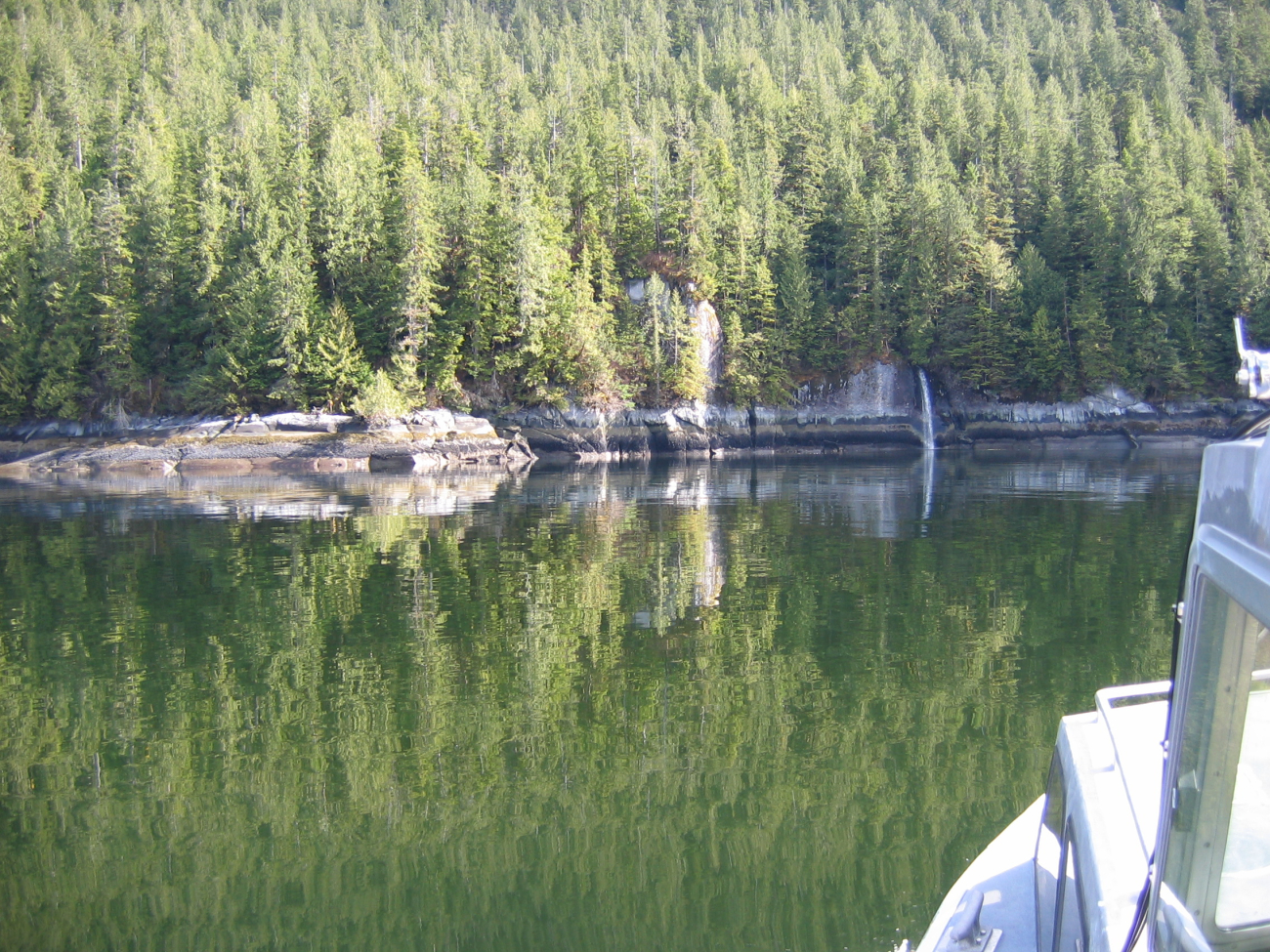 Horizontal strata on the shoreline and reflections in the still waters ofErnest Sound (Image credit: Crew and Officers of NOAA Ship FAIRWEATHER) Horizontal strata on the shoreline and reflections in the still waters ofErnest Sound