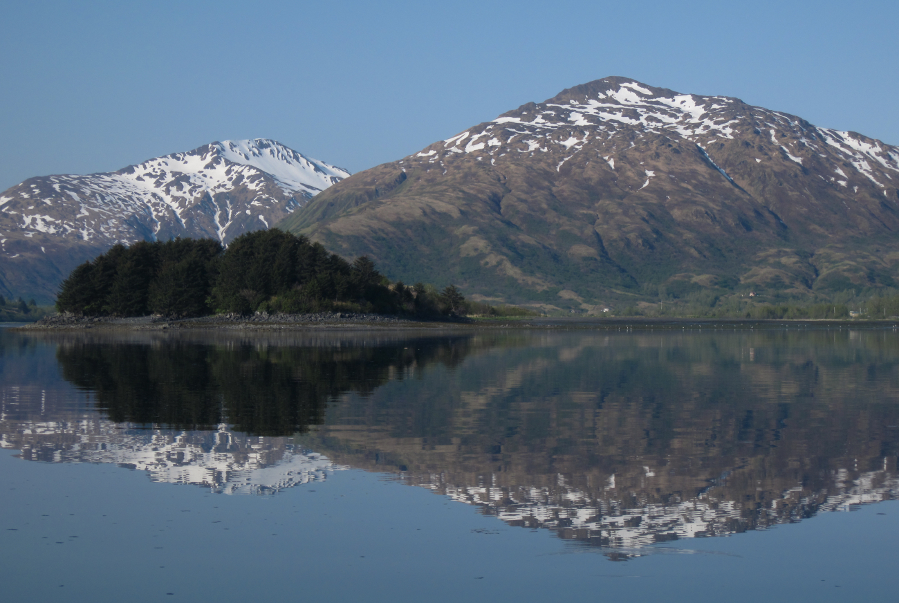 Kodiak mountain reflections on a calm cove (Image credit: Crew and Officers of NOAA Ship FAIRWEATHER | LTJG Damian Manda NOAA Corps) Kodiak mountain reflections on a calm cove