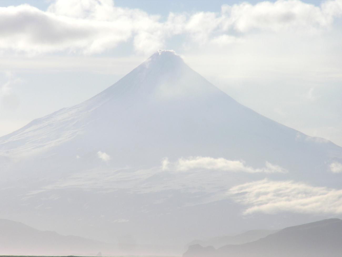 Shishaldin Volcano, among the most perfectly symmetrical volcanic cones on Earth (Image credit: Crew and Officers of NOAA Ship FAIRWEATHER) Shishaldin Volcano, among the most perfectly symmetrical volcanic cones on Earth