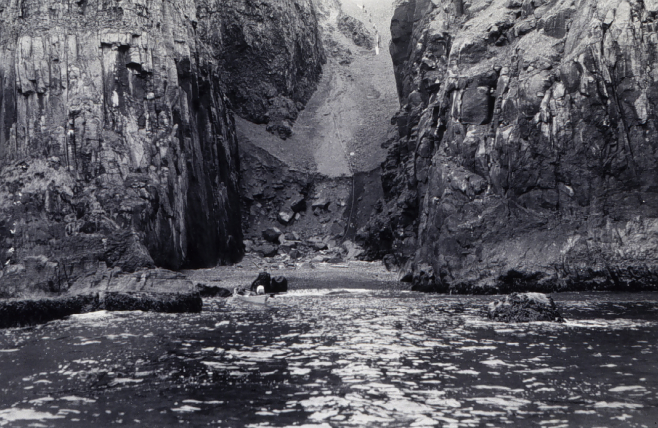 Carrying lumber up rift in cliffs at east end of Amlia Island (Image credit: C&GS; Season's Report Patterson 1941-73) Carrying lumber up rift in cliffs at east end of Amlia Island