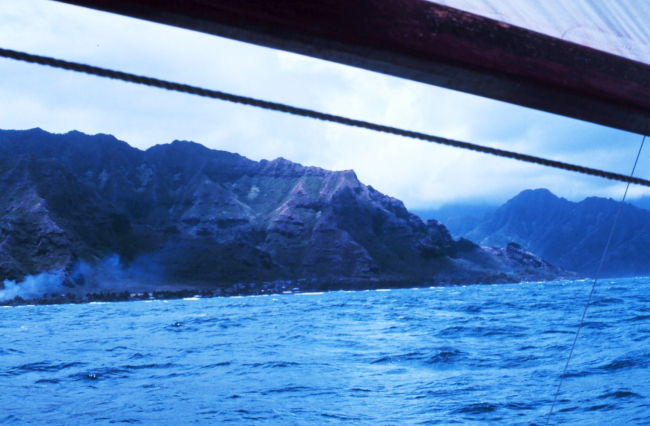Catamaran sailing off Hawaiian island