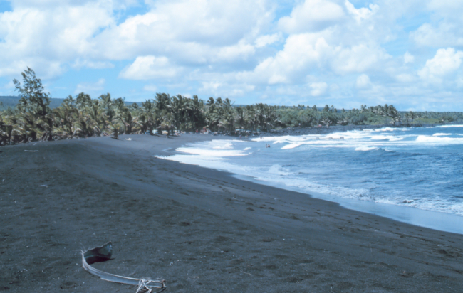 Black lava sand beach known locally as the Drainpipe - now destroyed by lavaflow