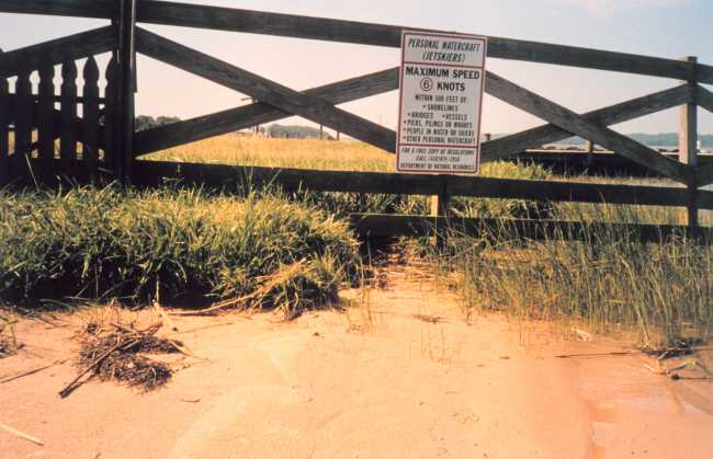Erosion - ironically below a sign stating boat speed limit to minimize wake anderosion