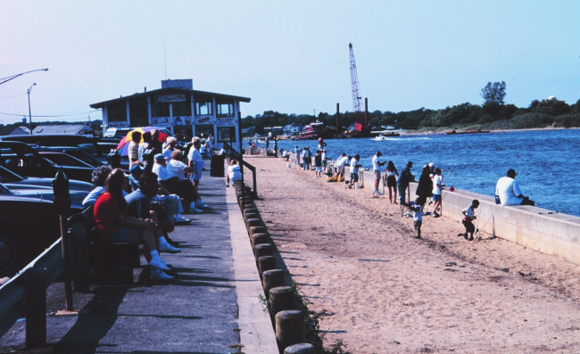 People fishing along Manasquan Inlet