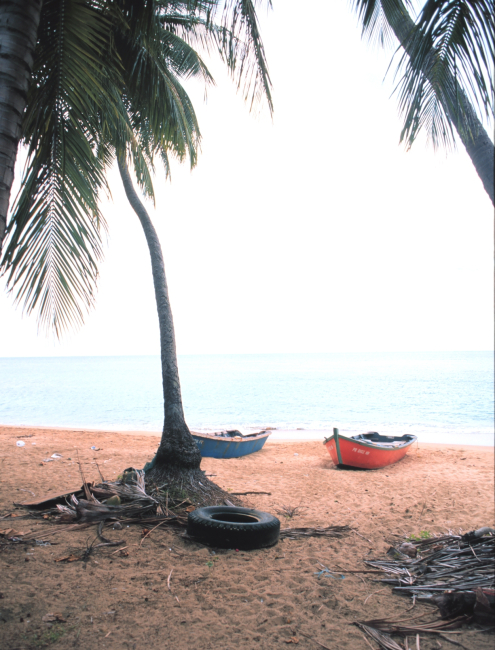 Boats pulled up on the beach at a small-scale fishing port