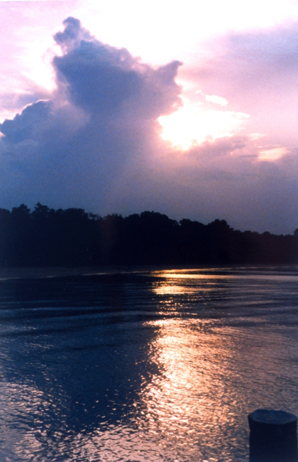 A thunderhead building over the Patuxent River at sunset