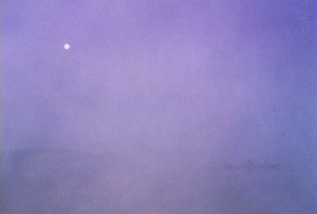 Kayaking on a foggy full moon night
