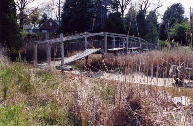 A footbridge crossing a small tidal creek