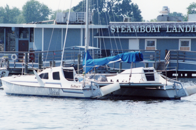 Riverside restaurant and catamaran sailboat