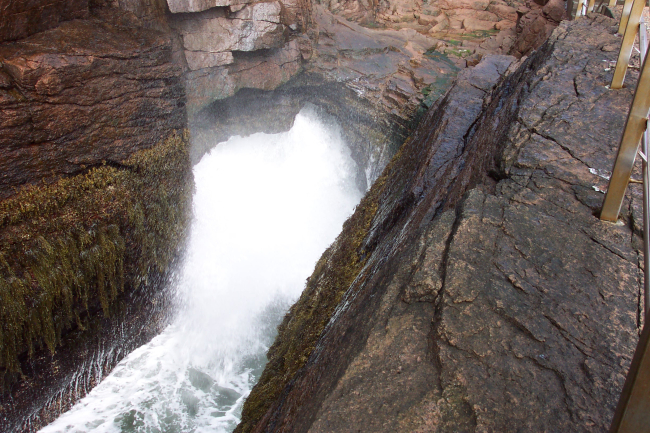 Thunder Hole, spray, water and thunderous sounds following the crash ofa North Atlantic swell