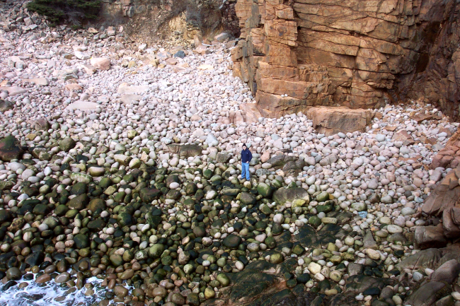 Human being in photo gives scale to big sand