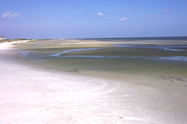 Shoals exposed after strong southerly winds drive the water north