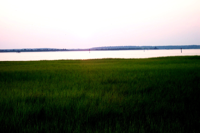 Tug boat at sunset at the Cape Fear River entrance