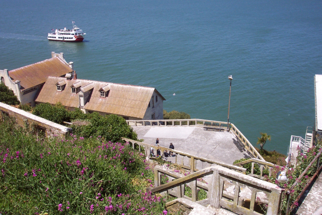 A tour boat cruises offshore from Alcatraz Island