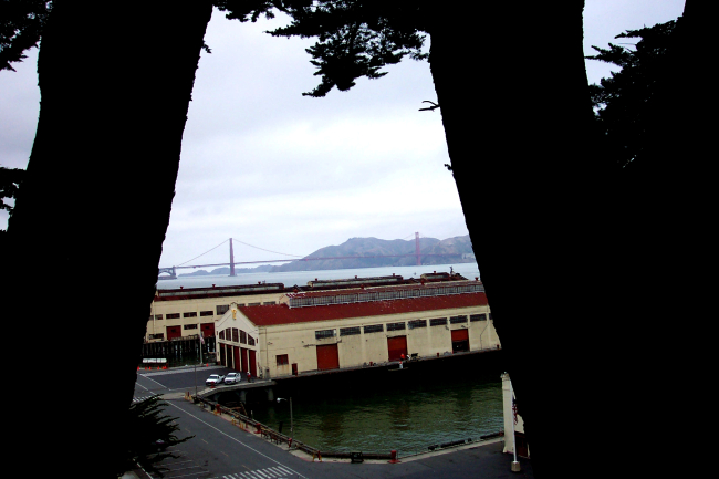 The Golden Gate Bridge as seen over the wharves at Fort Mason