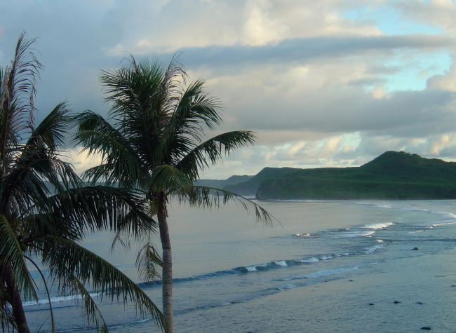 Waves striking the outer reef at the end of the day on Guam
