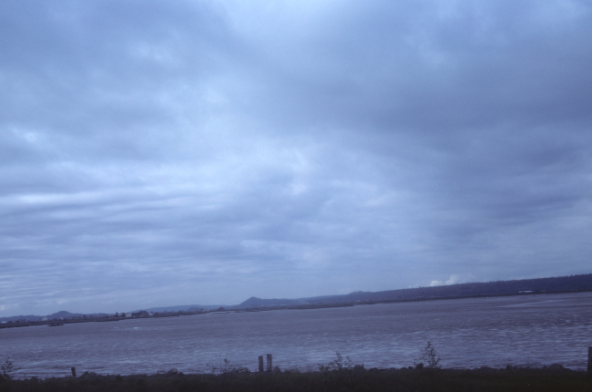 Shallow bay at low tide showing extensive mud flats