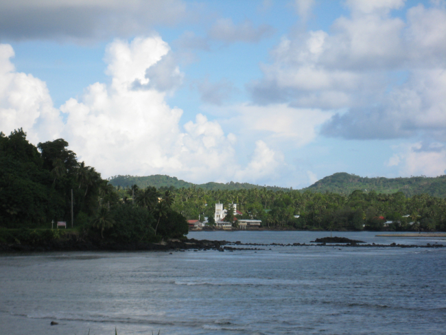 A church seen at the end of a bay on the western coast