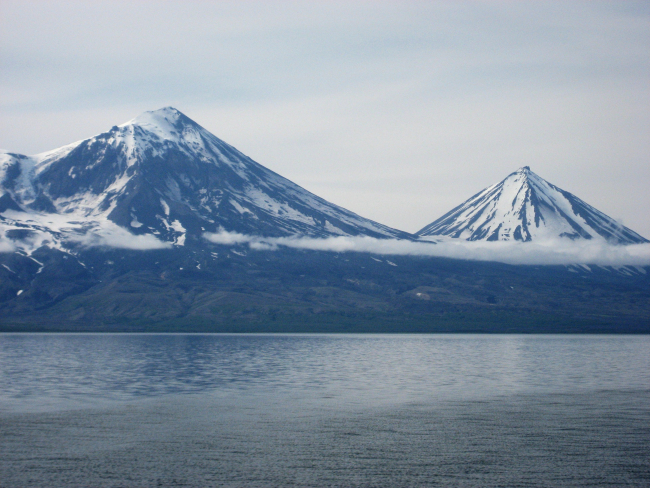 Pavlof and Pavlov Sister volcanoes as seen from Cold Bay area