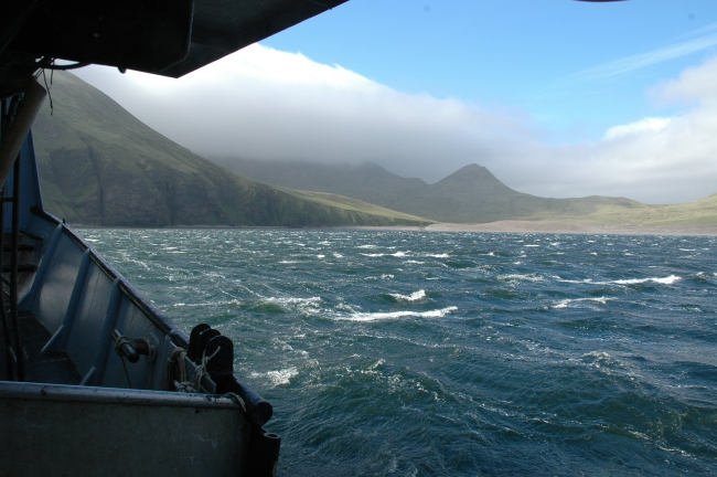 Fog blowing over the island while a williwaw stirs up the near shore waters