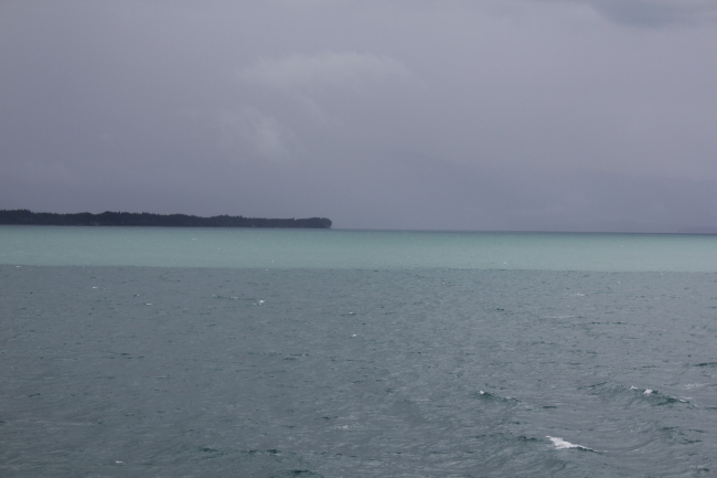 Glacial outwash line is demarcated by juncture between aqua and darker waters