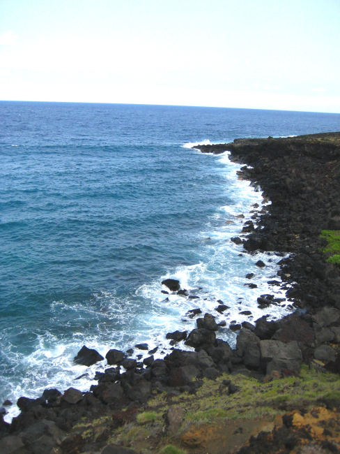 Basaltic boulders doing battle with the sea