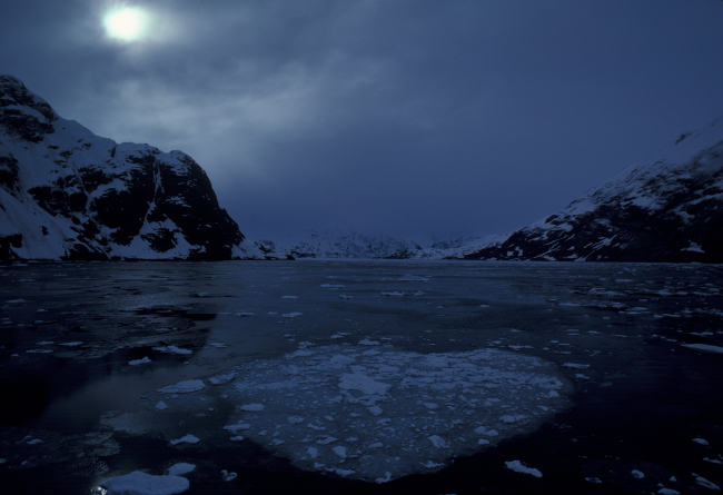 Sun illuminating clouds in Glacier Bay