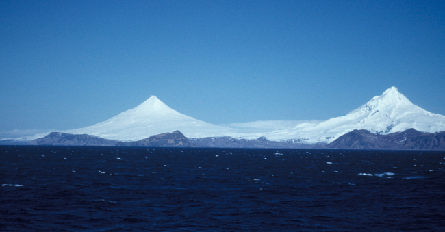 Magnificent view of Shishaldin and Isanotski volcanoes from offshore