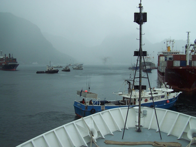 Seemingly randomly oriented boats and ships in Pago Pago Harbor ona rainy day