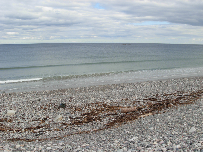 The storm surge and surf protection wall composed of cobbles at Scituate