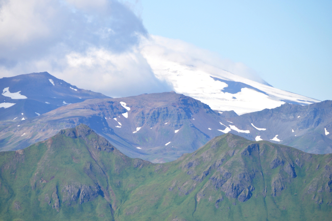 Looking towards Makushin Volcano over the green mountains of Unalaska Island
